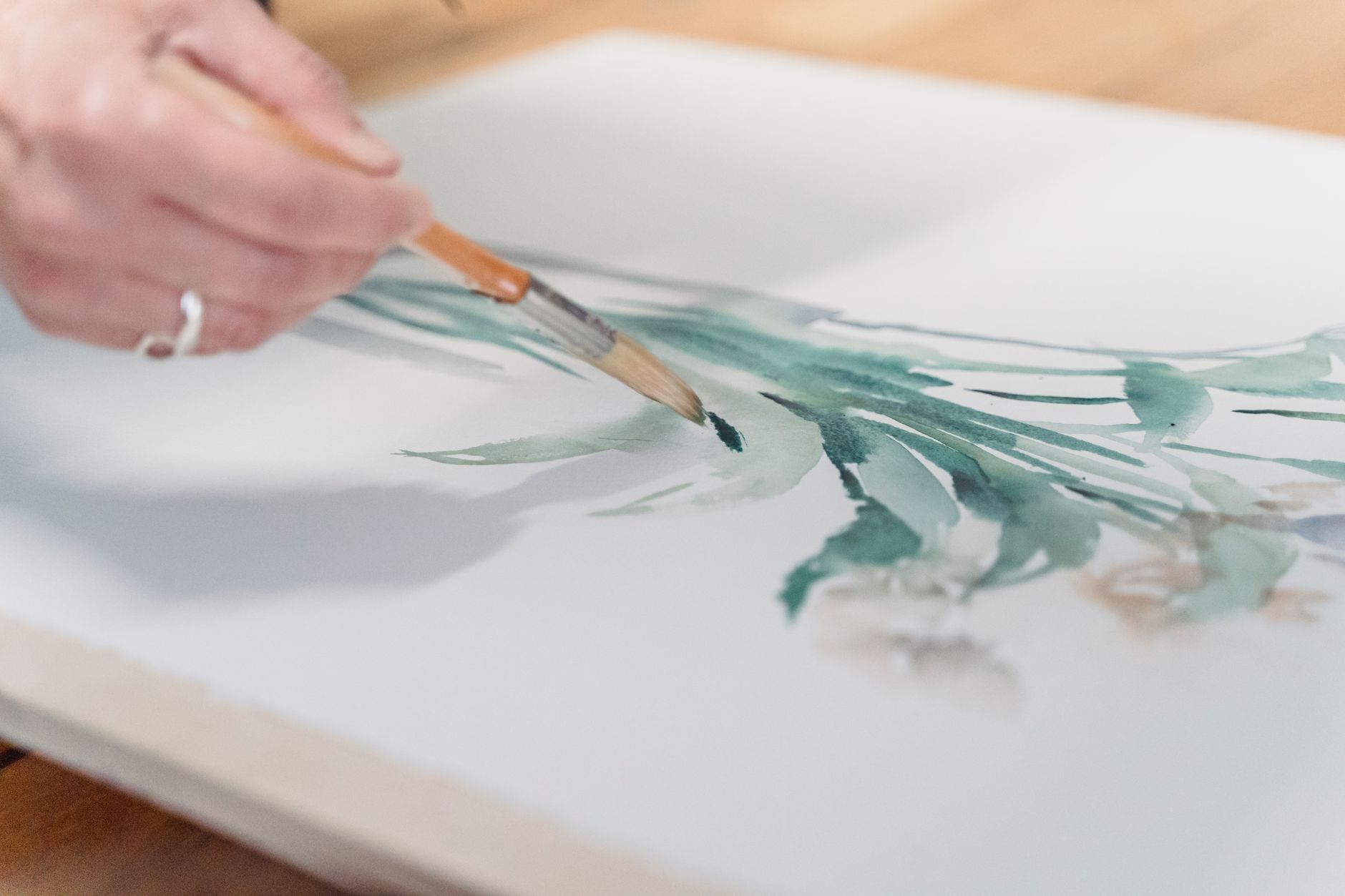 person painting an artwork