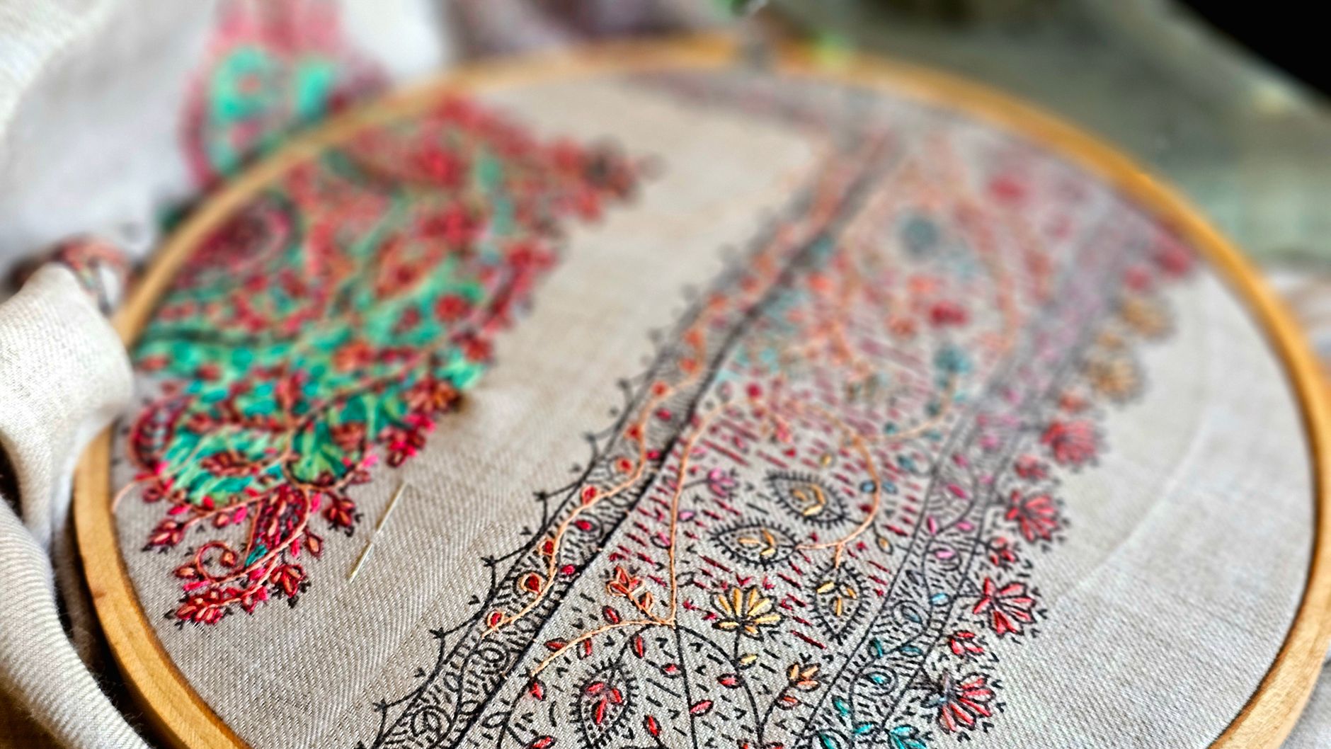 intricate hand embroidery on fabric hoop