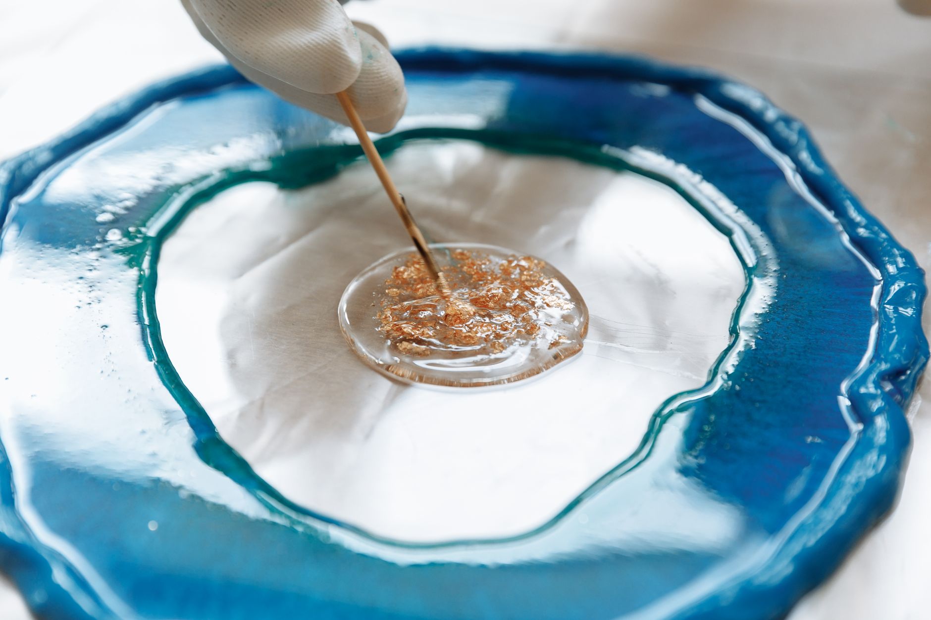 a person making a resin art