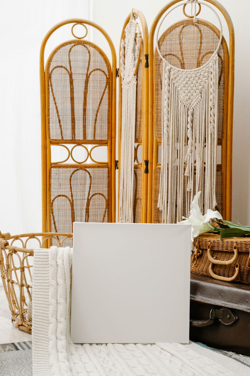 canvas placed against retro suitcases and folding screen