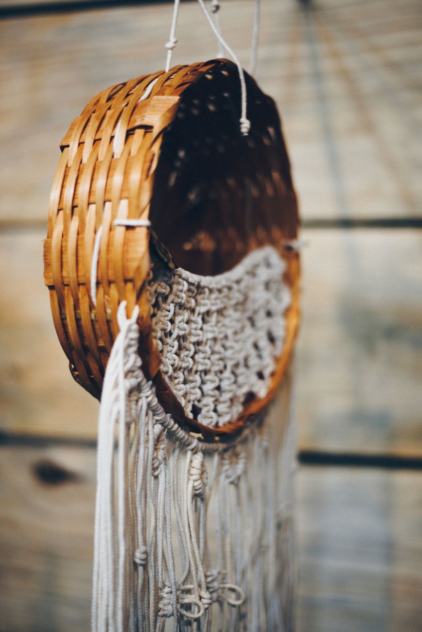 hanging wicker basket with woven macrame