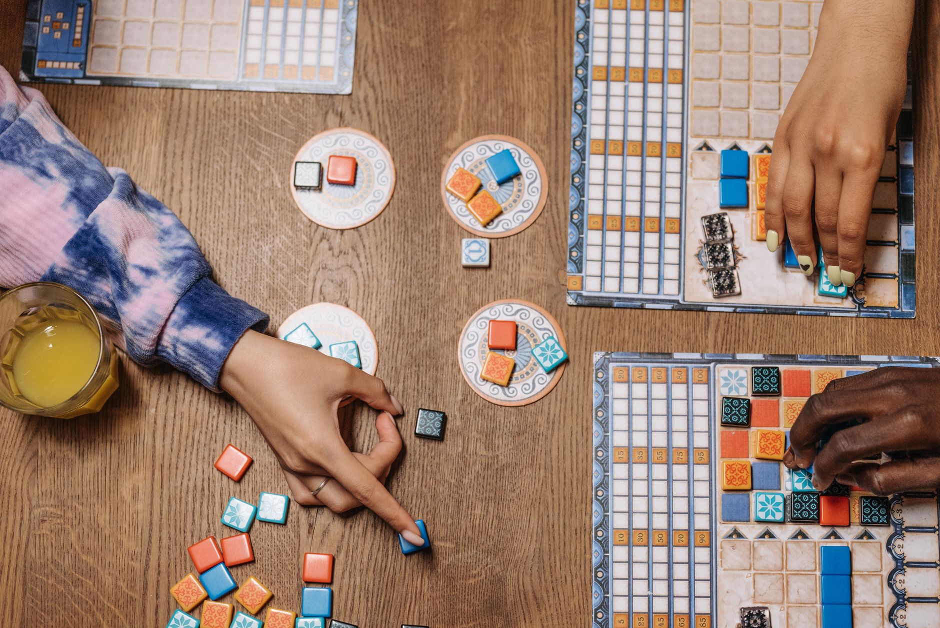 hands playing board games